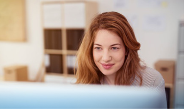 Student in class, viewing computer